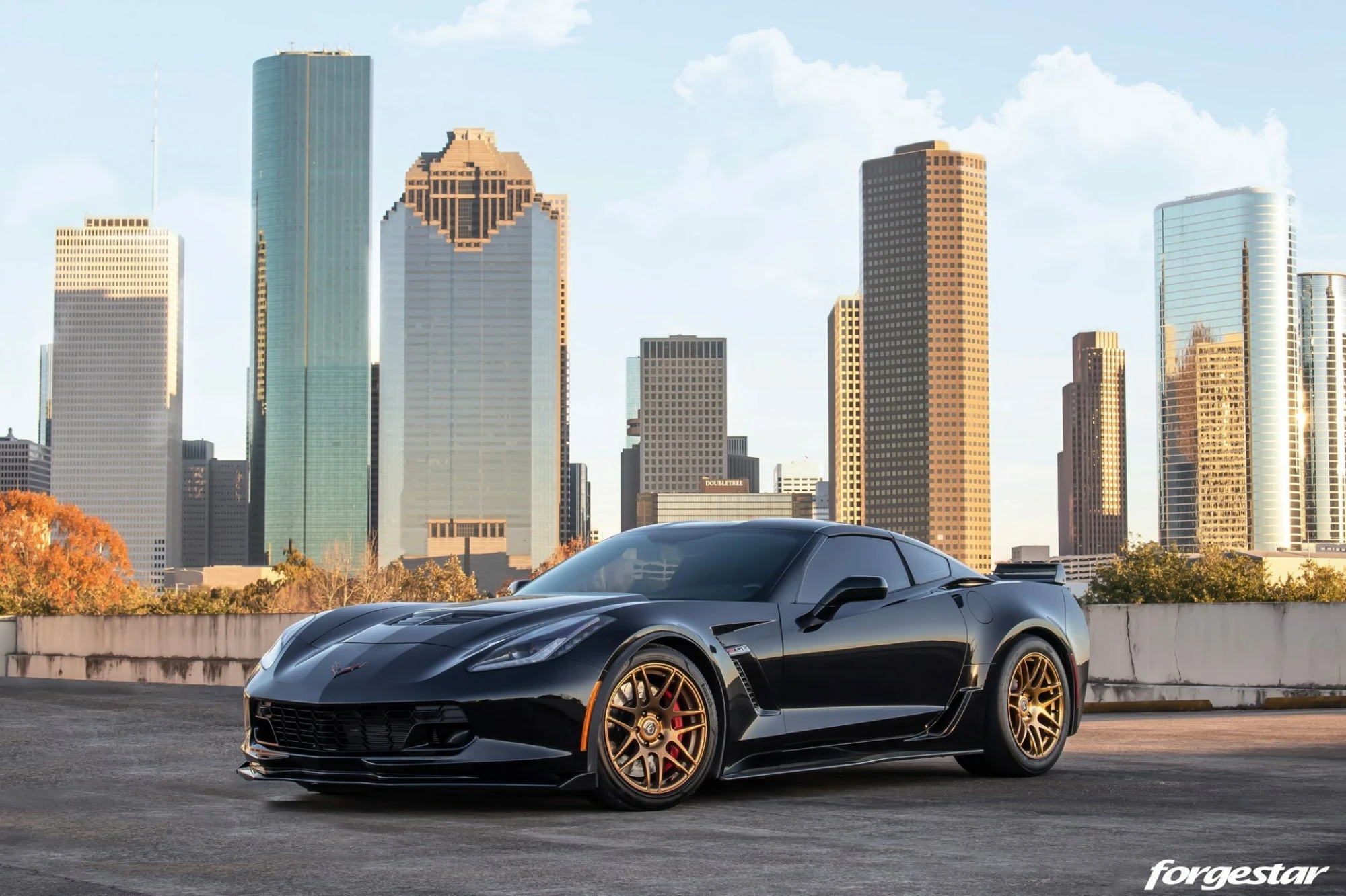 https://mwcompany-forgestar.files.svdcdn.com/production/galleryImages/_2000xAUTO_fit_center-center_90_none/17802/texas-c7-z06-corvette-chevy-custom-bronze-wide-forgestar-f14-wheels-concave-rims-a.webp